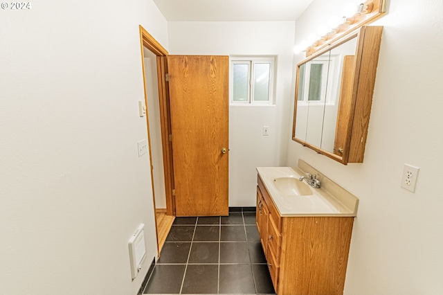 bathroom featuring tile patterned flooring and vanity