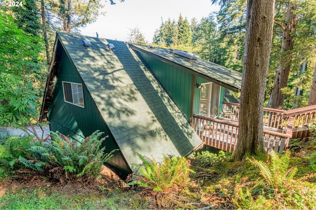 view of side of home featuring a deck