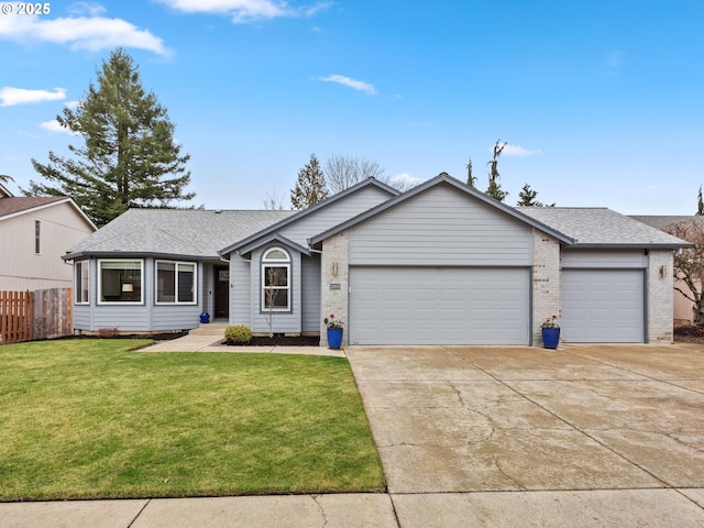 single story home featuring a garage and a front lawn