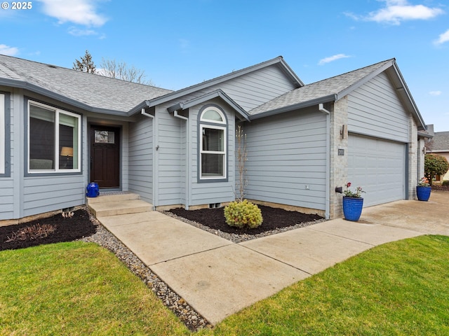 single story home featuring a garage and a front yard