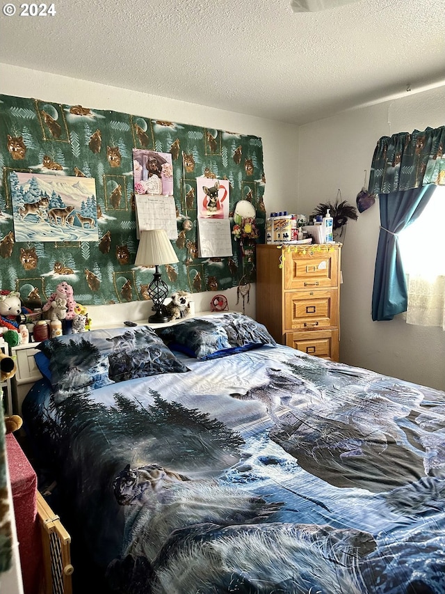 bedroom featuring a textured ceiling