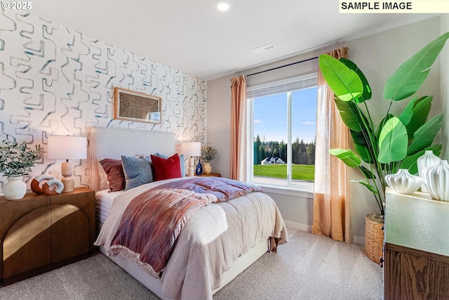 carpeted bedroom with a wall mounted AC