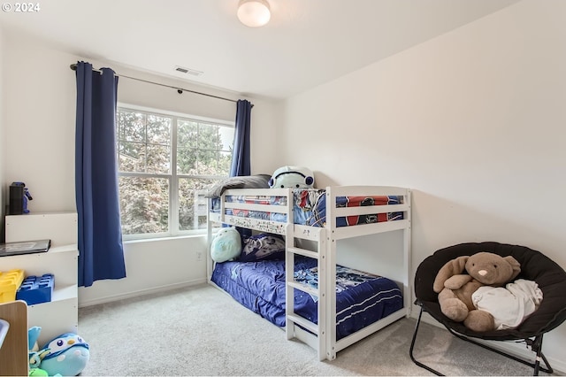 carpeted bedroom featuring multiple windows