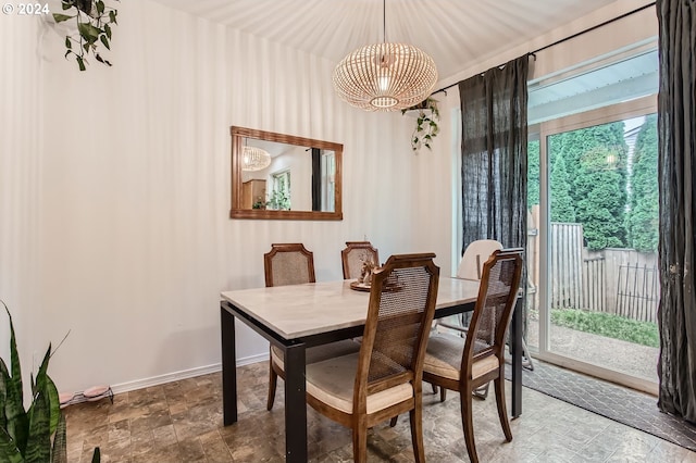 dining room with an inviting chandelier and a healthy amount of sunlight