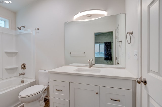 full bathroom featuring vanity, toilet, and washtub / shower combination