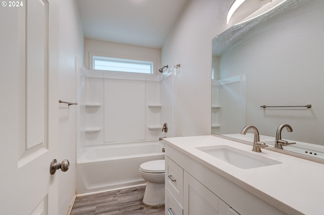 full bathroom with vanity, wood-type flooring,  shower combination, and toilet