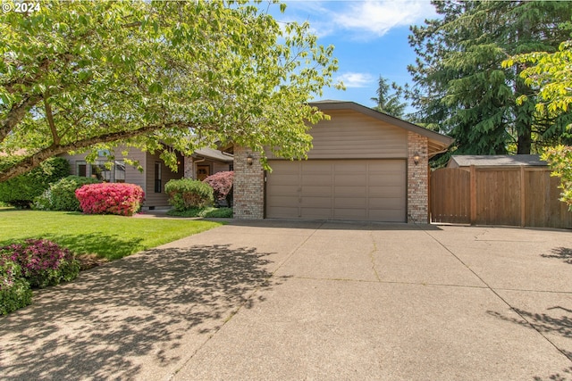 view of front facade with a front yard and a garage