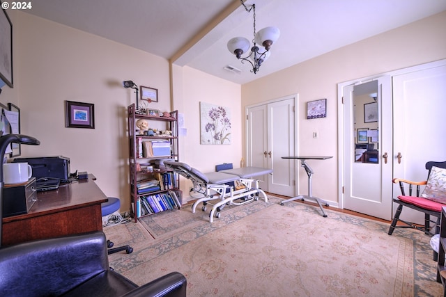 workout room with a notable chandelier