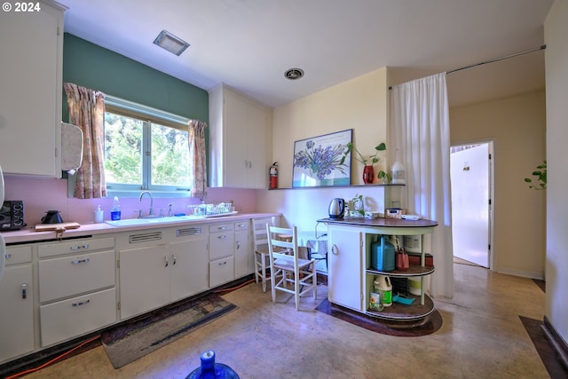 kitchen with sink and white cabinets