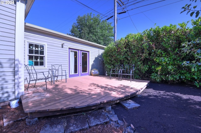 wooden deck featuring french doors