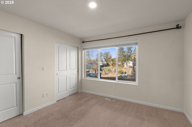 59 NE 134th Pl, Portland, OR 97230 - unfurnished bedroom with light colored carpet and baseboards