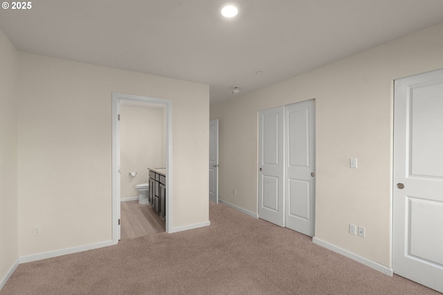 59 NE 134th Pl, Portland, OR 97230 - unfurnished bedroom with light colored carpet, baseboards, a closet, and connected bathroom