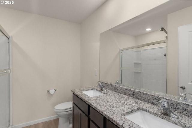 59 NE 134th Pl, Portland, OR 97230 - full bathroom featuring toilet, a shower with door, wood finished floors, and double vanity