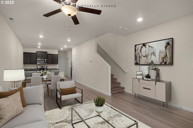 59 NE 134th Pl, Portland, OR 97230 - living area featuring light wood finished floors, stairs, ceiling fan, recessed lighting, and baseboards