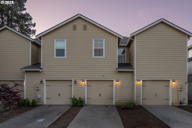 59 NE 134th Pl, Portland, OR 97230 - townhome / multi-family property with a garage and concrete driveway