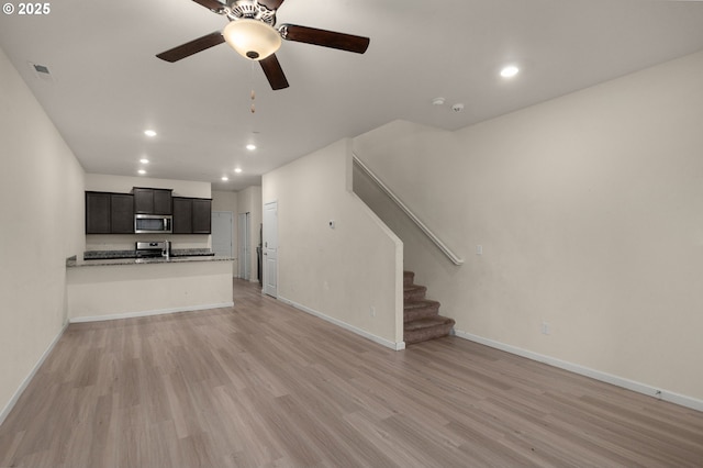 59 NE 134th Pl, Portland, OR 97230 - unfurnished living room with light wood-style flooring, recessed lighting, baseboards, ceiling fan, and stairs