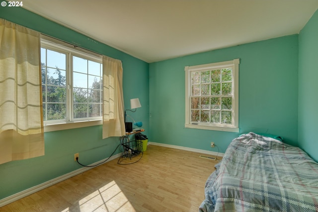 bedroom featuring light wood-type flooring