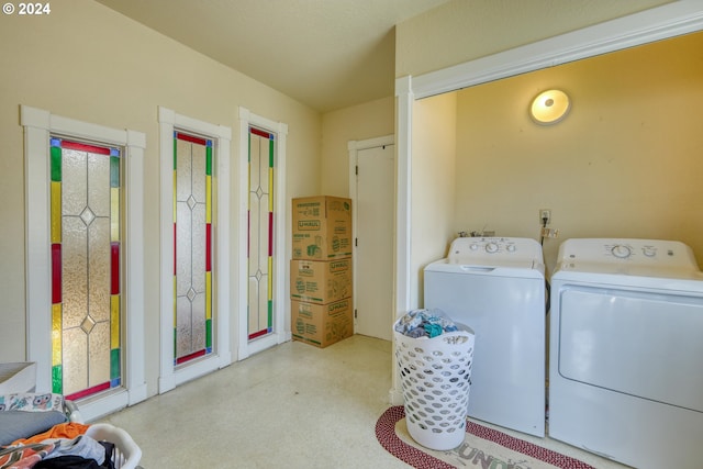 washroom with washing machine and dryer