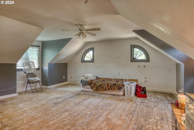 bonus room with ceiling fan, hardwood / wood-style floors, and vaulted ceiling