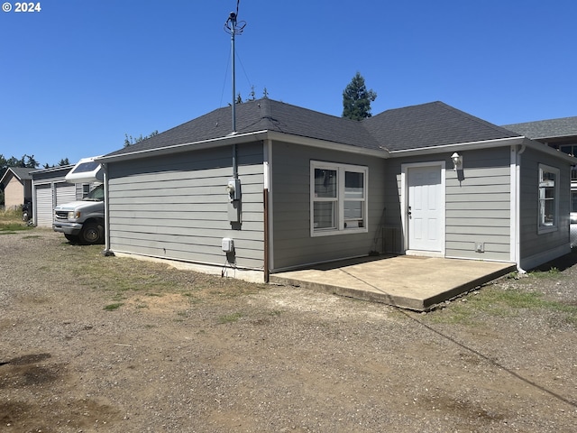 rear view of house featuring a patio