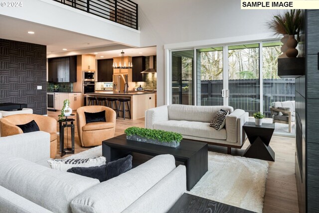 living room featuring hardwood / wood-style floors and a high ceiling