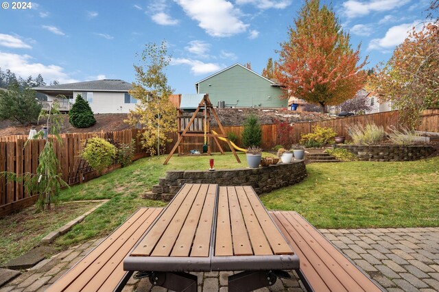 6905 Flicker Dr SE, Salem, OR 97306 - view of yard with a playground and a deck
