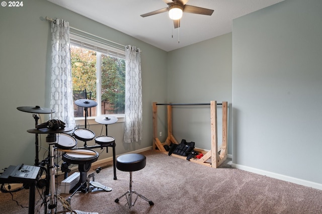 recreation room with ceiling fan and carpet flooring