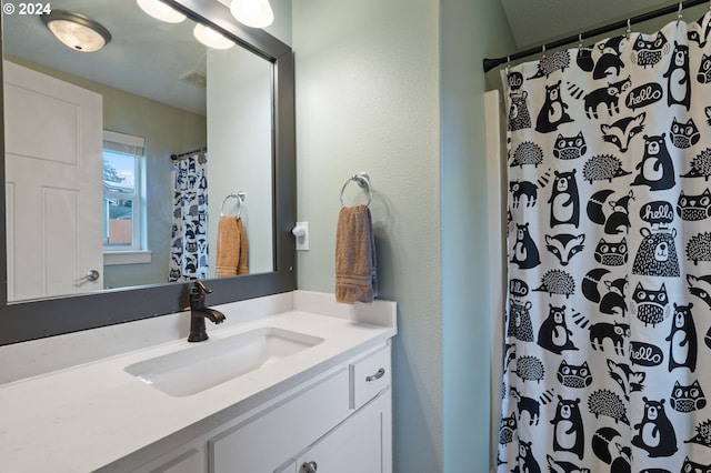 bathroom with vanity and walk in shower