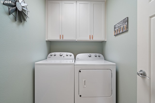 6905 Flicker Dr SE, Salem, OR 97306 - laundry area featuring separate washer and dryer and cabinet space