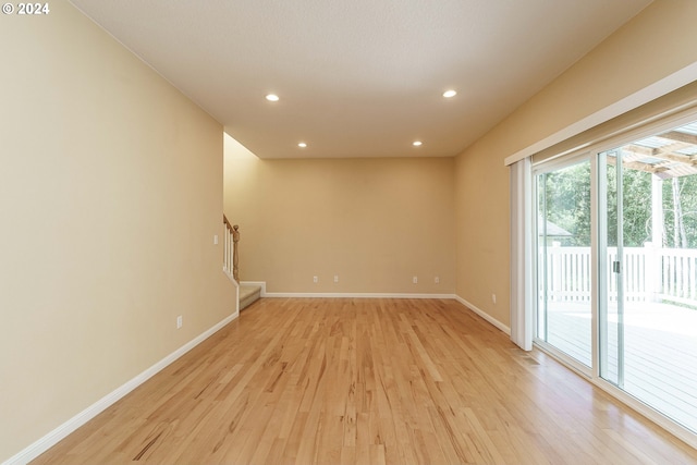 unfurnished room featuring light wood-type flooring