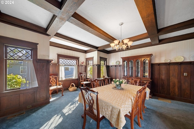 dining area featuring coffered ceiling, dark carpet, and beam ceiling