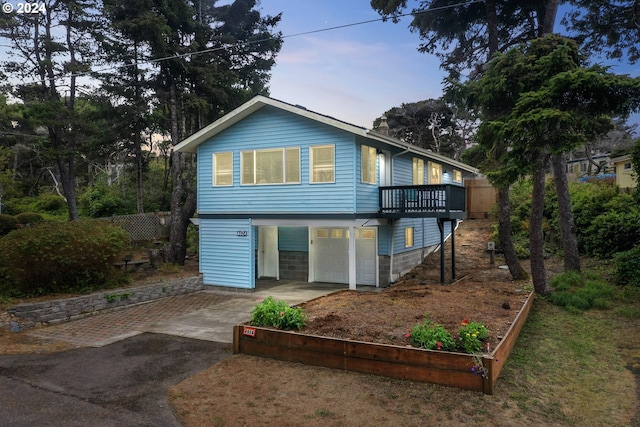 4624 Joshua Ln, Florence, OR 97439 - rear view of property featuring asphalt driveway and an attached garage