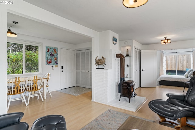 4624 Joshua Ln, Florence, OR 97439 - living room featuring a wood stove and wood finished floors