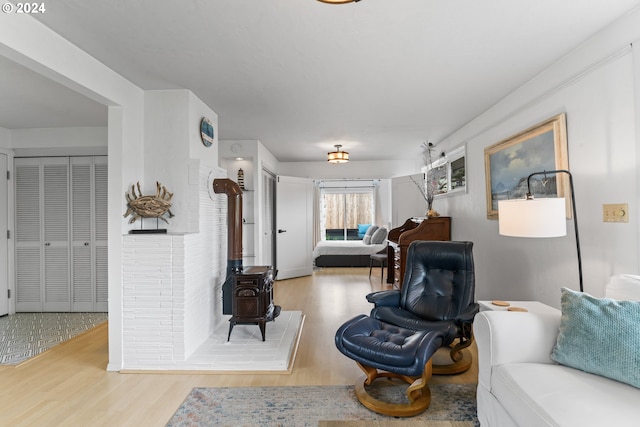 4624 Joshua Ln, Florence, OR 97439 - living area featuring a wood stove and wood finished floors