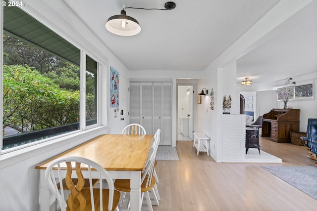 4624 Joshua Ln, Florence, OR 97439 - dining area with wood finished floors and a wood stove