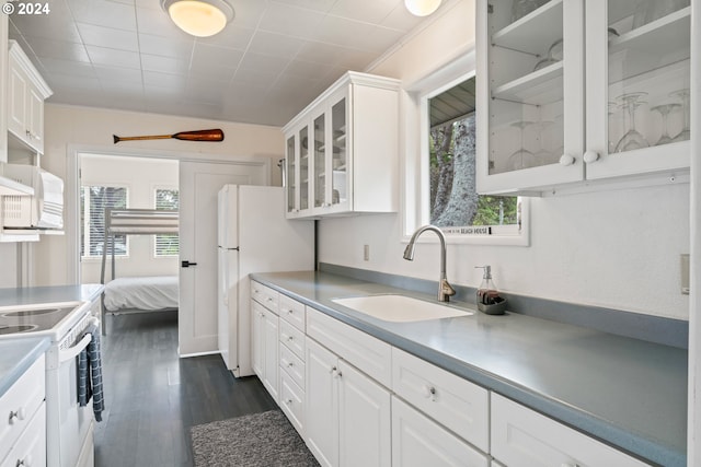 4624 Joshua Ln, Florence, OR 97439 - kitchen with white appliances, plenty of natural light, and white cabinetry