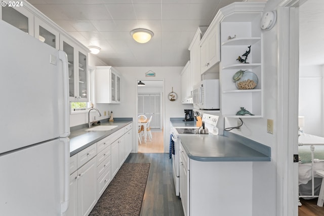 4624 Joshua Ln, Florence, OR 97439 - kitchen with white appliances, open shelves, dark wood finished floors, and white cabinetry