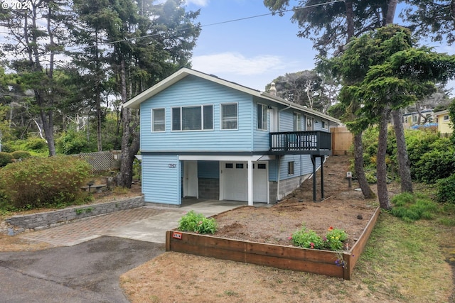4624 Joshua Ln, Florence, OR 97439 - view of front of house featuring asphalt driveway and a garage