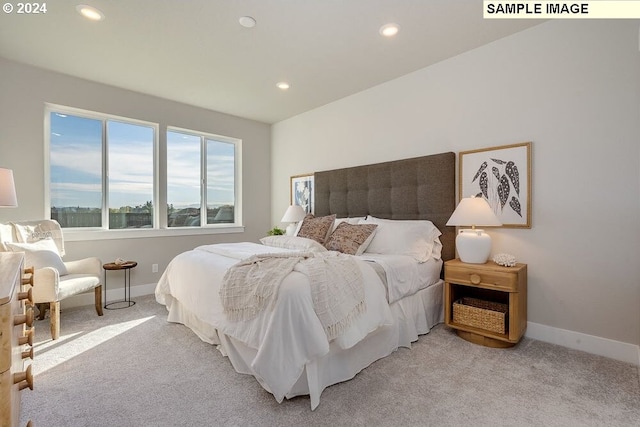 bedroom with light colored carpet