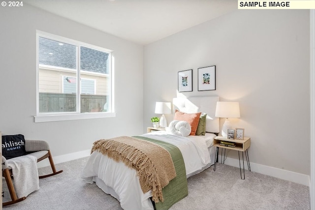 bedroom featuring light colored carpet