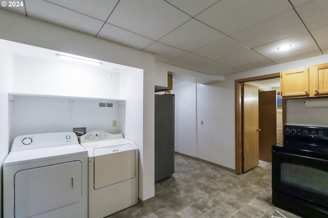 clothes washing area featuring washer and clothes dryer