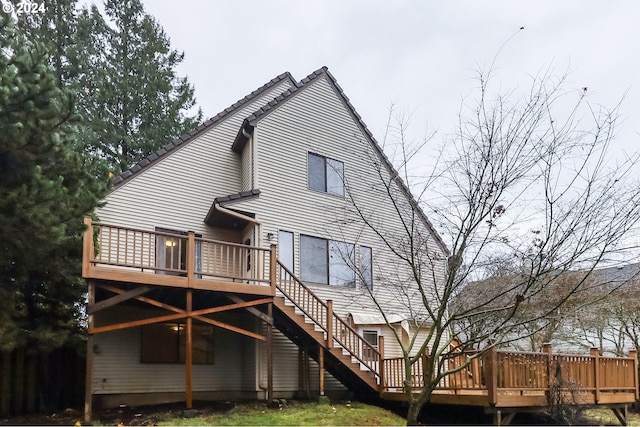 rear view of property with a wooden deck