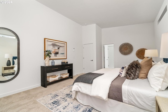 bedroom with light colored carpet