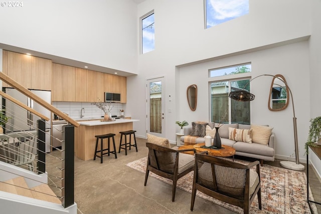 living room with a towering ceiling