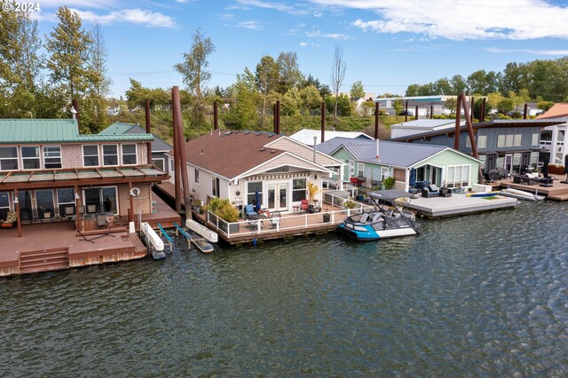 rear view of house with a water view