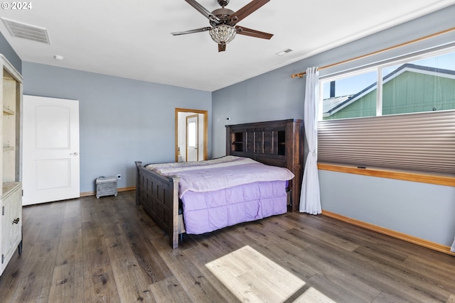 bedroom with ceiling fan and dark hardwood / wood-style flooring