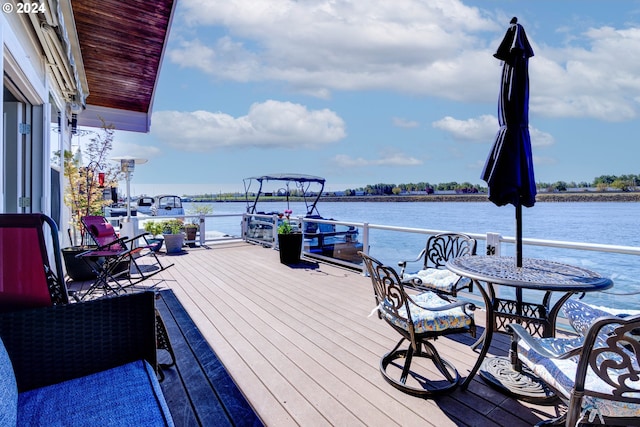 deck featuring a water view