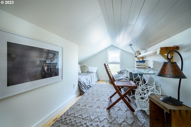 office space featuring hardwood / wood-style floors and lofted ceiling