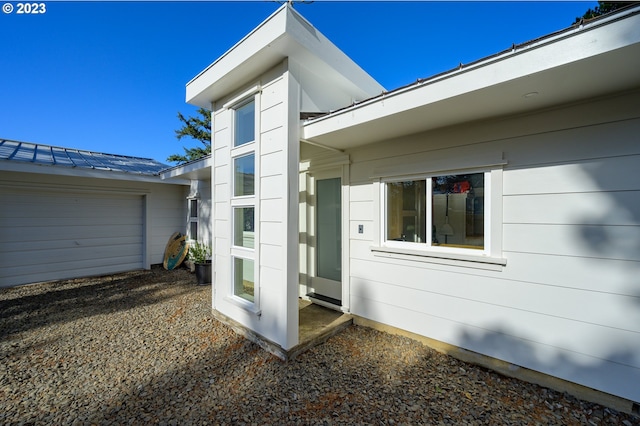 view of side of property with a garage