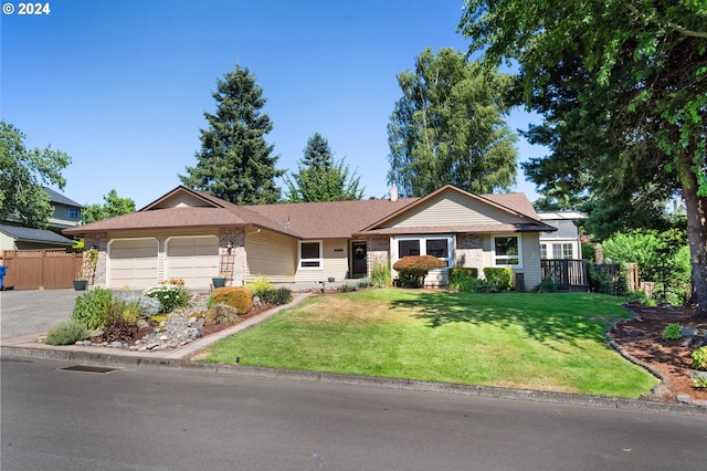 ranch-style home with a front yard and a garage